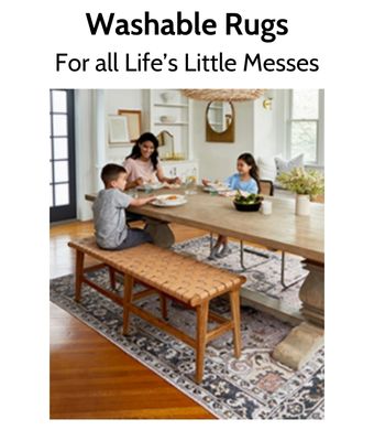 Happy family seated at dinner table over washable rug.